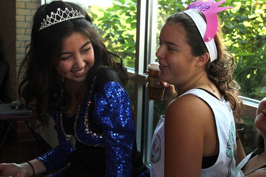 Seniors Maria Arroyo and Katie Byers laugh at each other’s “Toddlers and Tiaras” themed costumes. 