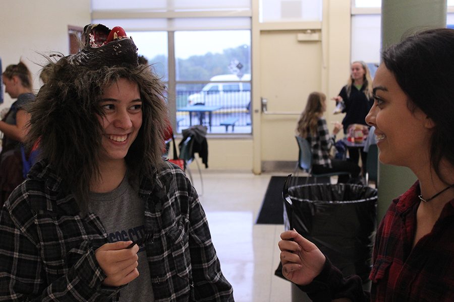 Juniors Melissa Hamilton and Anna O’Byrne chat during lunch in their “Twilight” costumes. 
