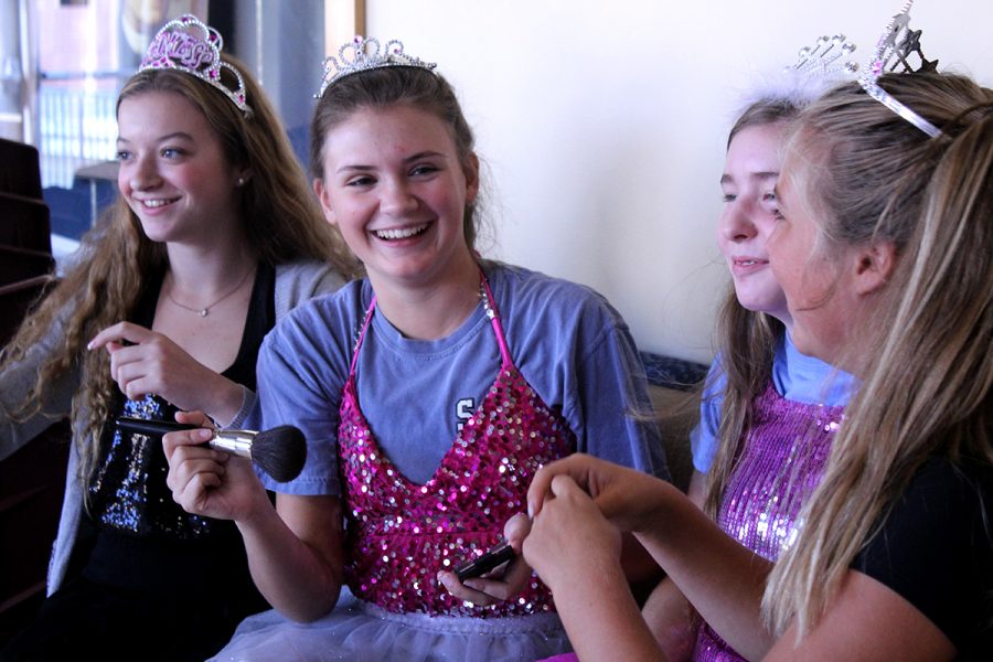 Sophomores Molly Conway, Savannah Childress, Maddie Griffin, Emily Koca and Mimi Wright get into the “Toddlers and Tiaras” theme by helping each other apply makeup. 