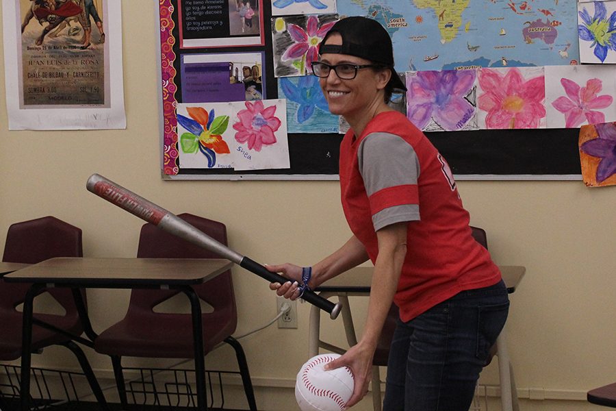 Spanish teacher Leah La Faver demonstrates her baseball skills in correlation with the faculty’s theme of “Sandlot” the third day of Spirit Week.
