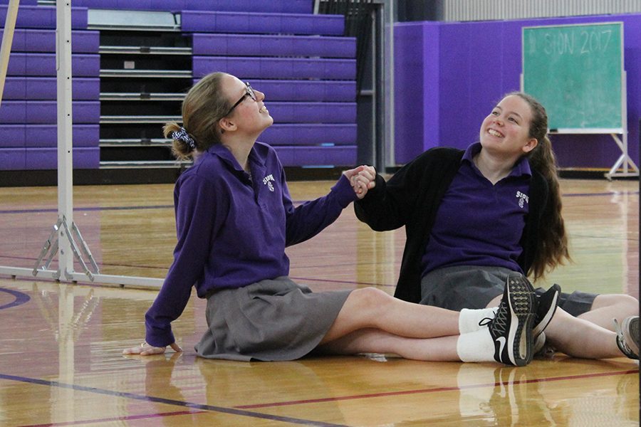 Sisters senior Grace Prusa and sophomore Tess Prusa were chosen as volunteers to represent the chemicals inside one's brain. 