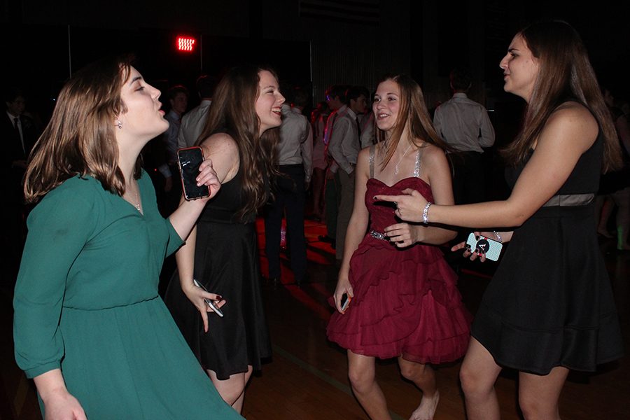 Sophomores Ellie Gamble, Tess Prusa, Kelsey Wilcoxson and Anna Nastasi create a dance circle, dancing to “Party in the USA.”