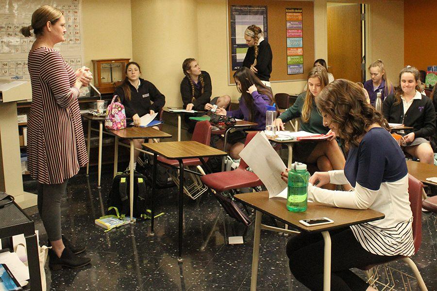 Director of College Counseling Erin Stein, far right, sits in on a chemistry class taught by Kelly Timson.