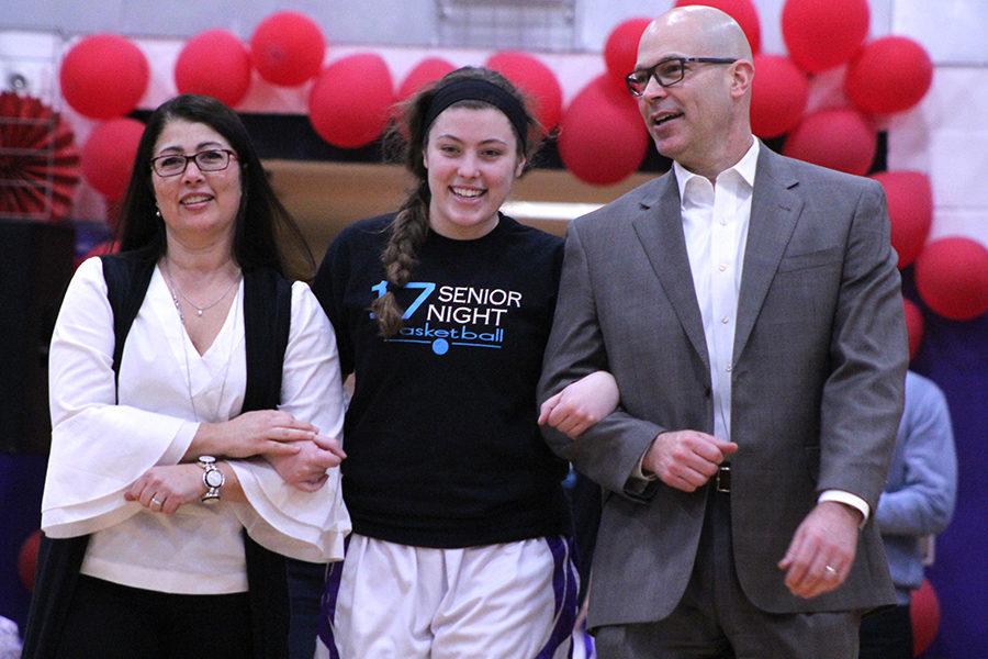 Senior Chloe Long was honored for her commitment to the basketball team alongside her mother and father.