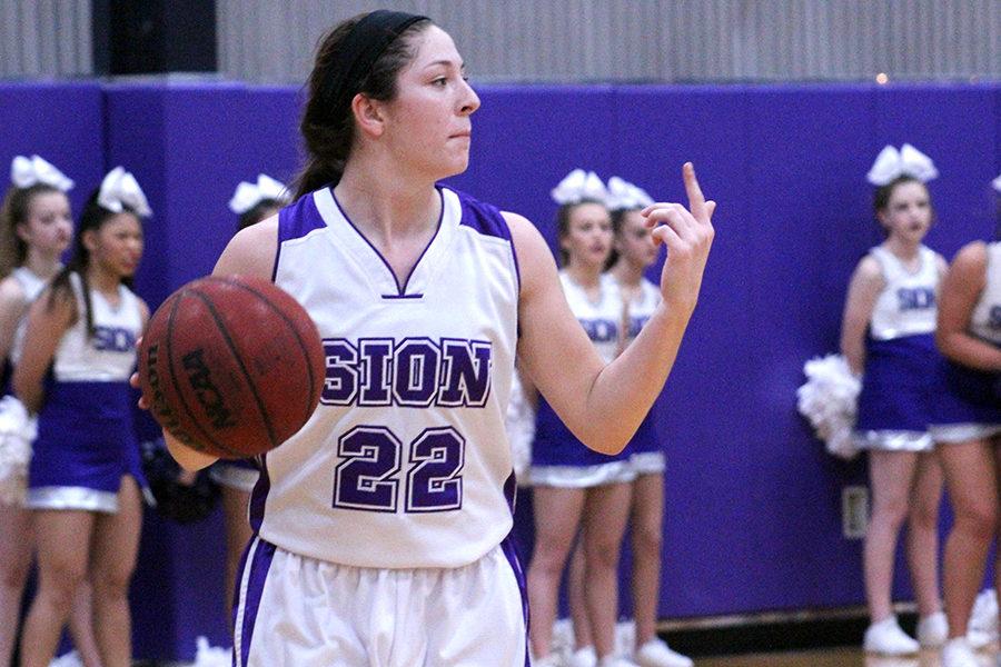 Junior Sarah Totta yells to her teammates about the next play.