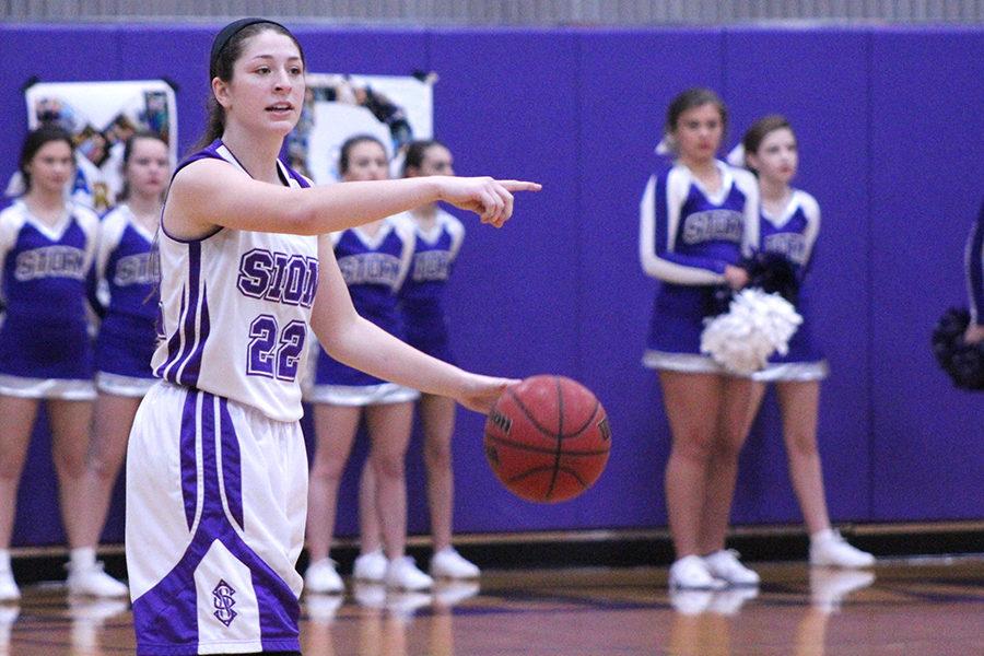 Junior Sarah Totta tells her teammates of the next play. 