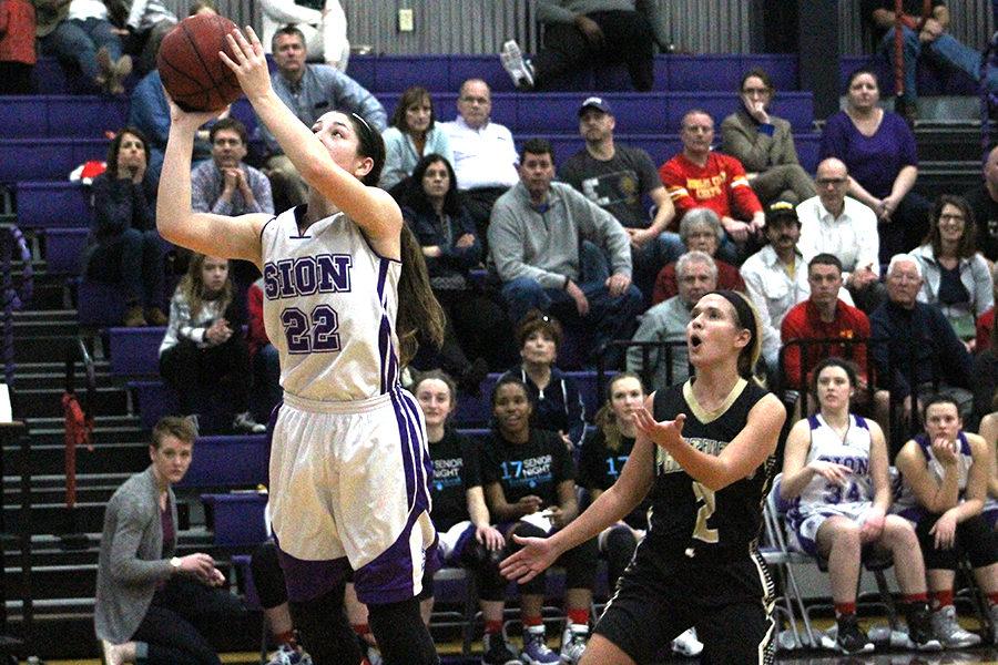 Junior Sarah Totta goes up to take a shot during the last quarter of the game.