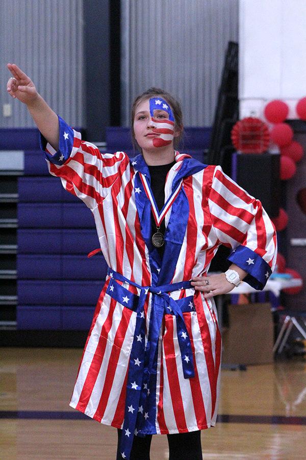 Senior class president Zoé Trouvé salutes the senior class after receiving the first place medal on behalf of the senior class.