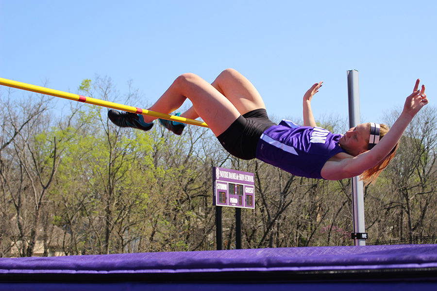 Junior Ella Anstoetter clears the bar during the high jump. Anstoetter went on to receive first place in the five foot high jump.