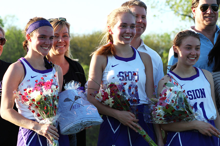 Seniors Megan Ostrander, Elsa Brundige and Mia Tebbe received a bouquet of flowers and a monogrammed blanket for their commitment to the team.