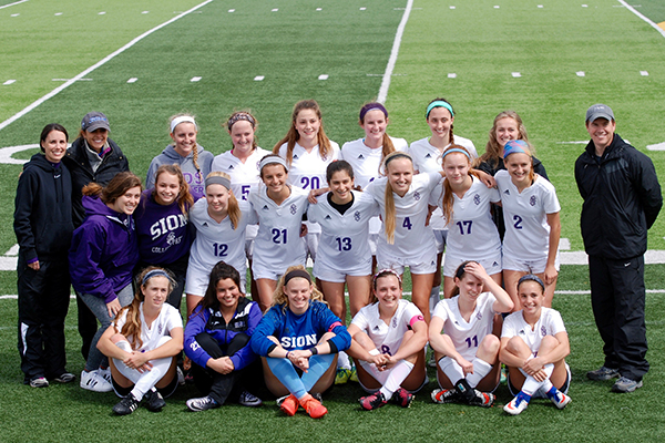 Varsity Soccer poses for a team picture after their win against Lee's Summit North. 