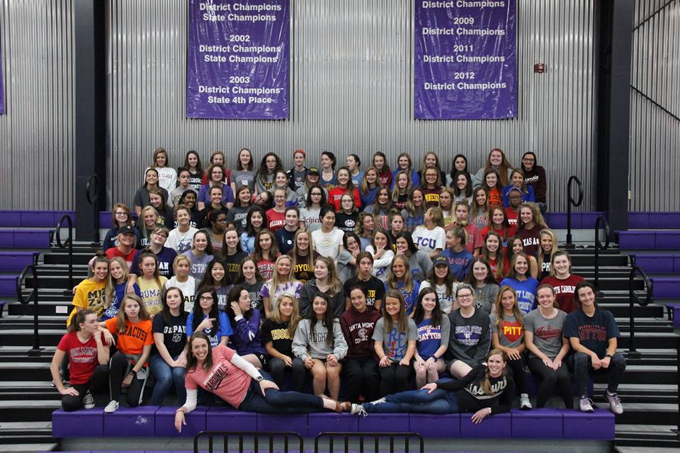 The senior class gathered for a class photo in their future school colors in the gym.