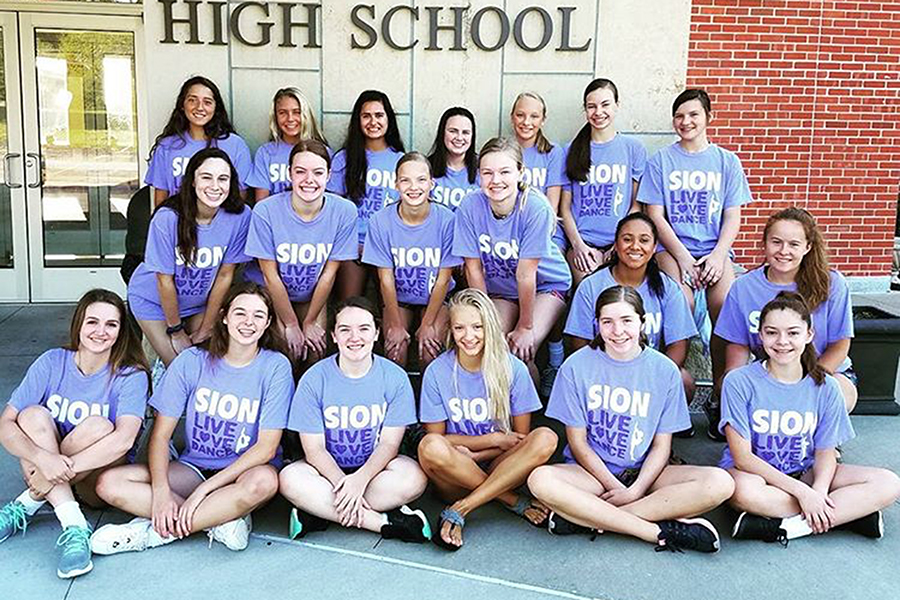 The dance team poses for a picture before heading to camp. 