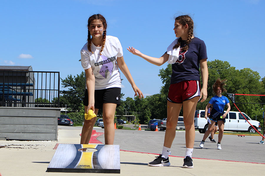 Freshman Aprille Castaneda grimaces with freshman Aly Heffner while playing "Cornhole."