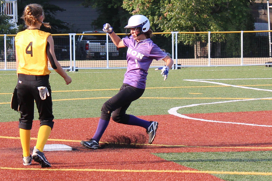 Sophomore Brooke Walker is ready to round second base and run to third after a ball was hit at the softball game Sept. 13.