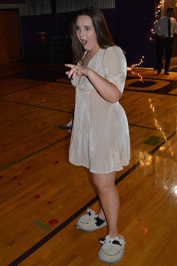 Senior and STUCO executive president Carolyn Dickey gasps after walking into the dance and seeing her friends.