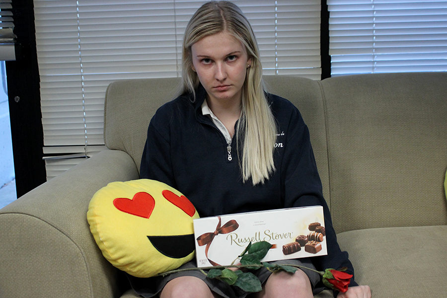 Senior Anna Tomka cringes when she sees Valentine’s Day advertisements and is angry when given things such as chocolates, roses and heart-related items for the holiday.