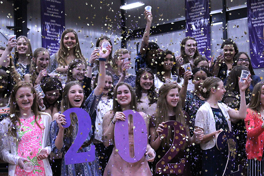 After the signing ceremony, the class of 2022 celebrates with confetti and “2022” cardboard cutouts used for pictures.