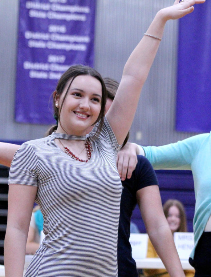 Senior Jordan Harrison dances while impersonating English teacher Casey Engel during the senior skit Oct. 25.