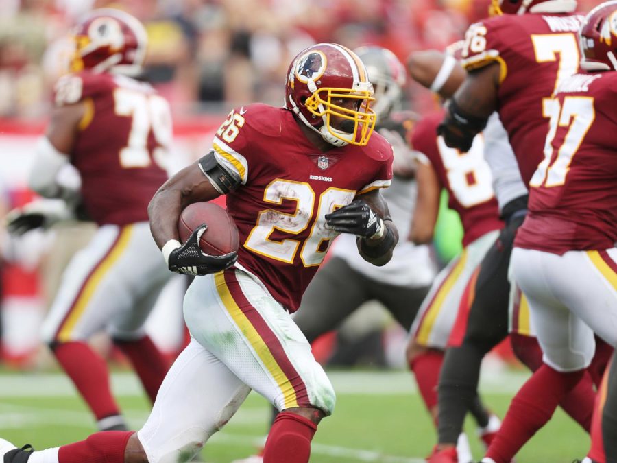 Washington Redskins running back Adrian Peterson (26) runs the ball for a first down against the Tampa Bay Buccaneers on November 11, 2018, at Raymond James Stadium in Tampa, Fla. (Monica Herndon/Tampa Bay Times/TNS)