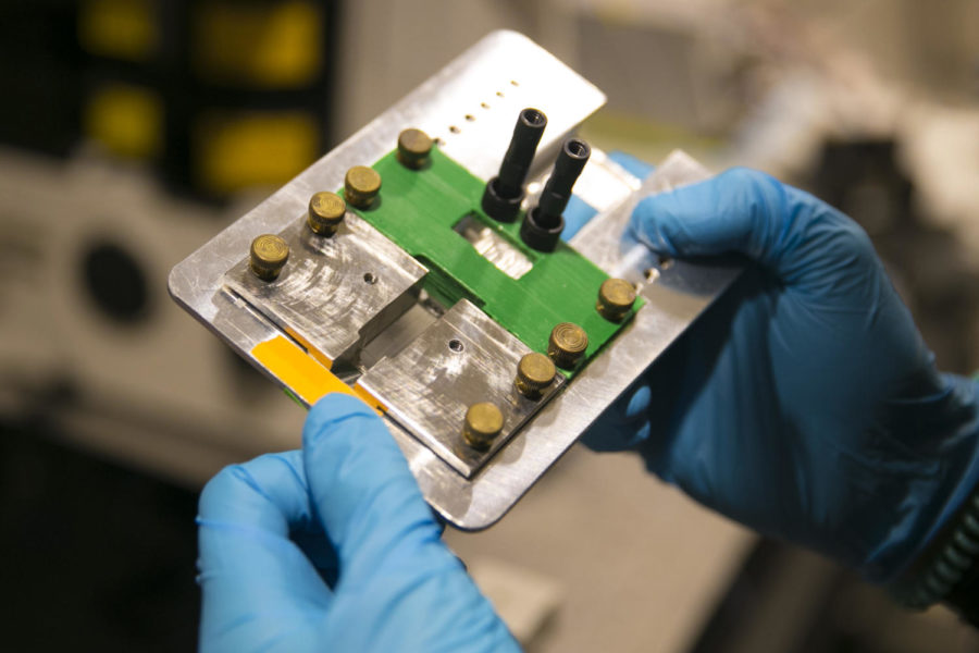 Stephen Jones, a molecular biology postdoctoral, shows the CHAMP, a device created for scientists to more safely use a new kind of gene editing technique called CRISPR, in the laboratory of UT professor Ilya Finkelstein Aug. 11, 2017.  Photo by MCT Campus.