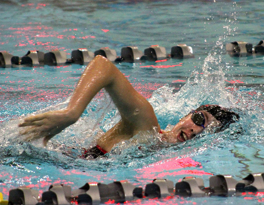 During the 400 yard freestyle relay, junior Bridget Schumm comes up for a breath as she finishes up her leg of the relay during the State prelims Feb. 15 in Saint Louis, Missouri. The team’s 11th place finish in prelims earned them a spot in the State finals.