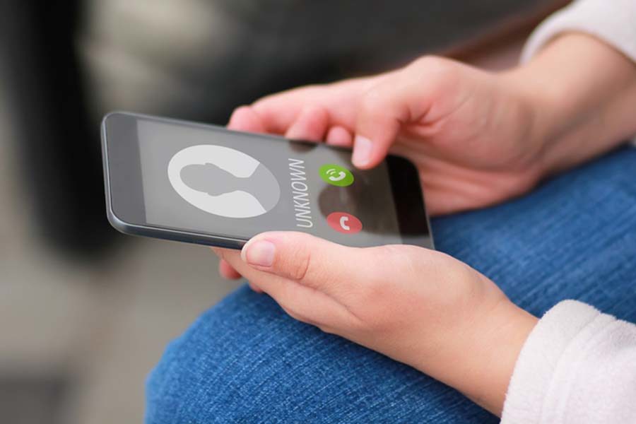 Close up of woman&apos;s hands with smartphone and unknown incoming phone call on it. (KSTU-TV/iStockphoto/TNS)