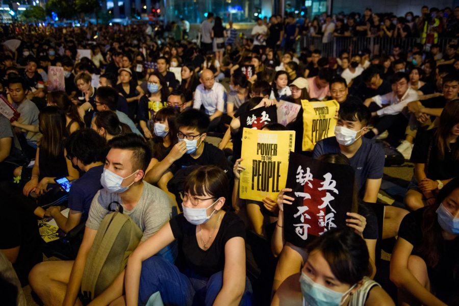 During a protest rally in front of the Chater Garden in the Central District, participants hold up signs with the inscription "Power to the People" on August 16, 2019. (Gregor Fischer/DPA/Abaca Press/TNS)