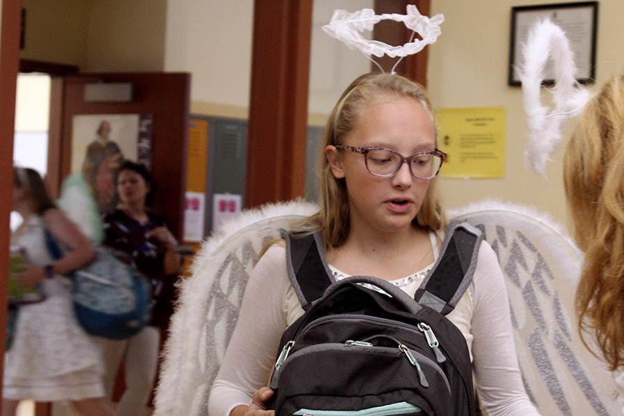 Senior Brie Bowes enters her second-hour class with white, feathered angel wings and a halo Sept. 11 for the third day of Spirit Week. 