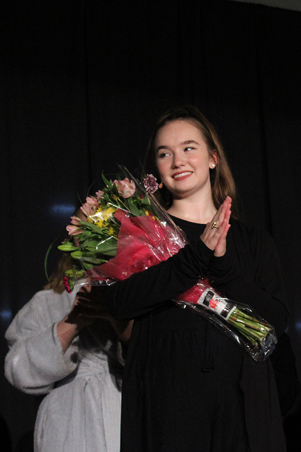 Cast and crew gifted co-director senior Peyton Wade with a flower bouquet at the conclusion of Night of One Acts Oct. 9. 