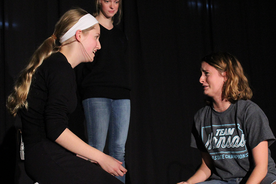 In a round of "Four Corners" improv, freshman Lauren Millard and senior Phoebe Mullen perform a scene given by an audience member at Night of One Acts Oct. 9.