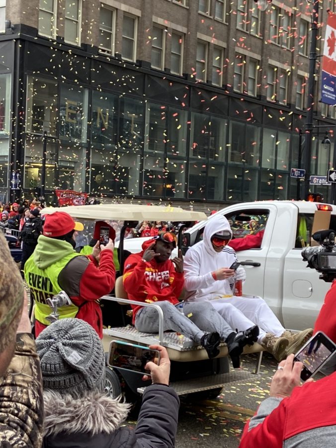 Chiefs wide receiver Tyreek Hill is surrounded by fans as he rides on the back of a golf cart at the Chiefs victory parade Feb. 5. Hill had 105 receiving yards at Super Bowl LIV.