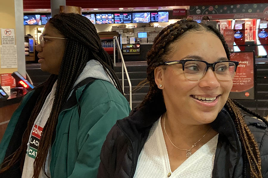 Seniors Maya Scott and Tehya Frederick wait in line at ticketing for the 7:00 p.m. showing of "Just Mercy" Feb. 4. Students were offered the opportunity to attending a free screening of the NAACP Image Award-nominated film in partnership with Rockhurst High School and St. Teresa's Academy.