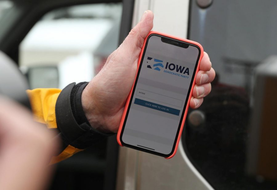 Precinct chair Carl Voss, of Des Moines, shows the phone app he used for the Iowa Caucus to news media at the Iowa Democratic Party headquarters, Feb. 4, 2020, in Des Moines.