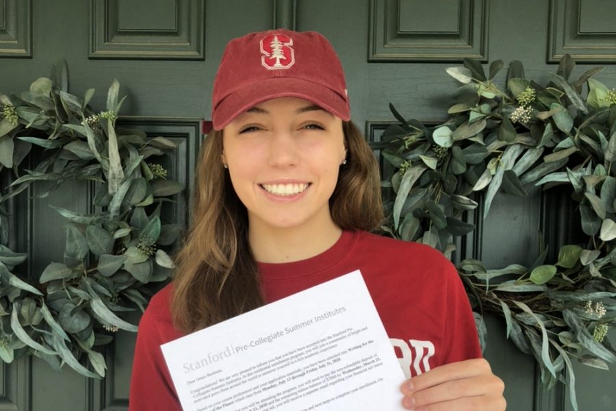 Sophomore Grace Beelman proudly displays her Stanford Pre-Collegiate Summer Institute letter March 4.