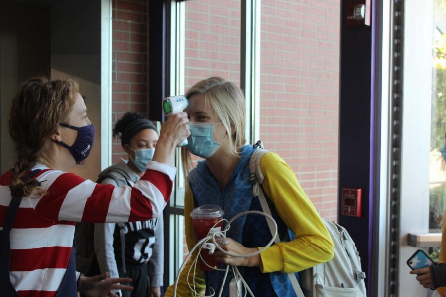 Junior Grace Townsend brings in her can donations for Food For Thought on Oct. 30.