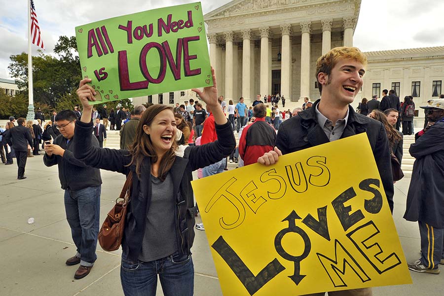 Students from St. Mary&apos;s College, including Allison Yancone, left, offered a counter-message to the signs displayed by members of the Westboro Baptist Church group outside the U.S. Supreme Court in Washington, D.C., Wednesday, October 6, 2010. Supreme Court justices pondered the vexing question of whether the father of a dead Marine from Westminster, Maryland, should win his lawsuit against the fundamentalist church group that picketed his son&apos;s funeral. (Amy Davis/Baltimore Sun/MCT)