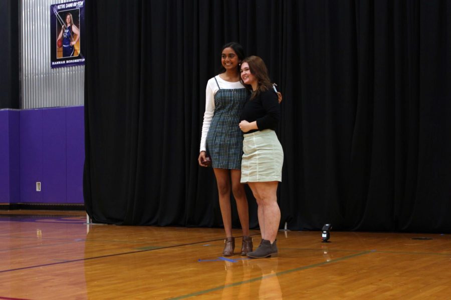 Senior Rajitha Velakaturi and class of 20' alumn Hannah Sue Kennish pose in front of the photographer after Velakaturi received her ring. 