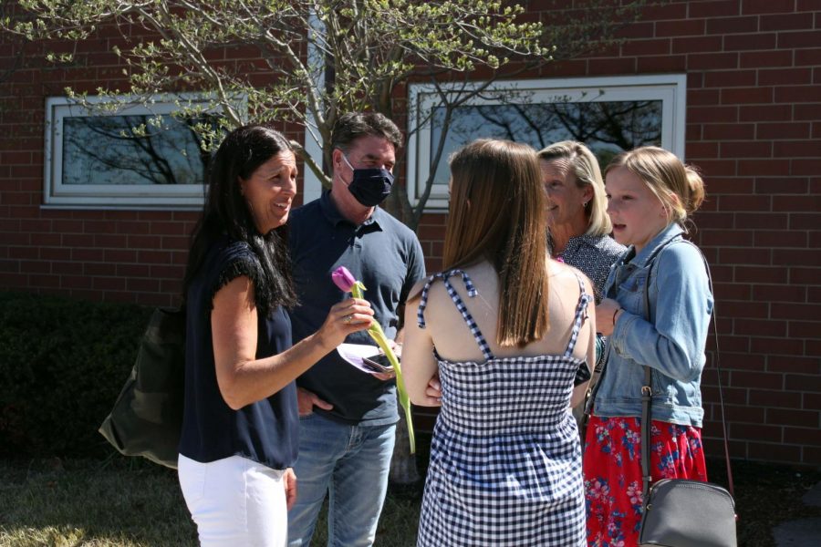 Class of 19' alumna Molly Conway converses with her family after presenting her sister with her junior ring.  