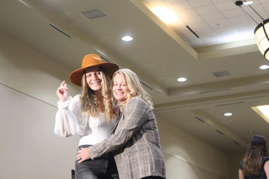 Senior Ashley Ulowetz gets a tight hug from her mom Kim at the end of the show. 