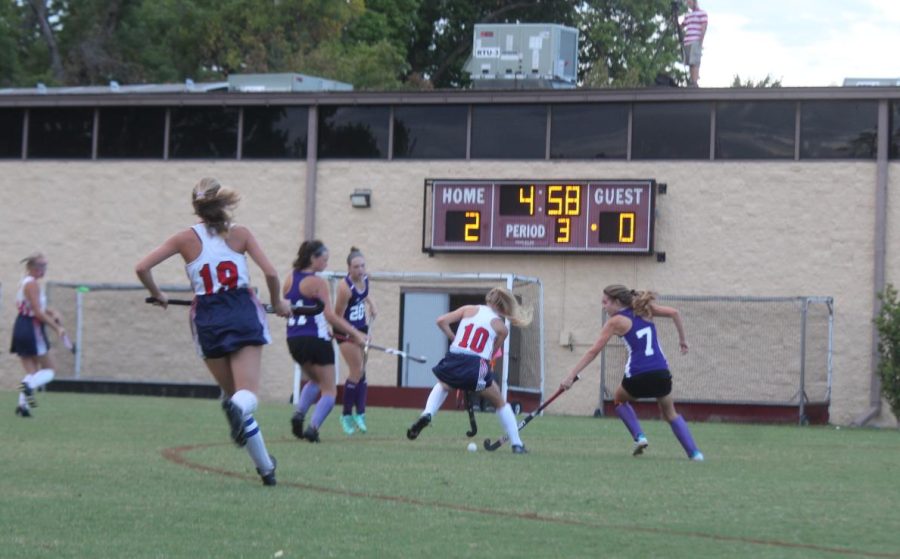 Senior Lauren Shaw races after the ball.