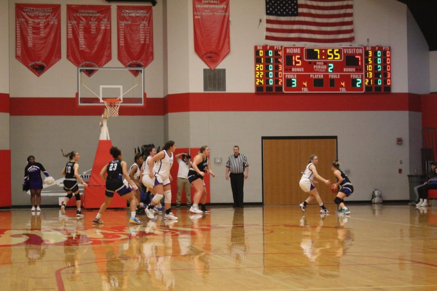 Both teams battle for control of the ball. 