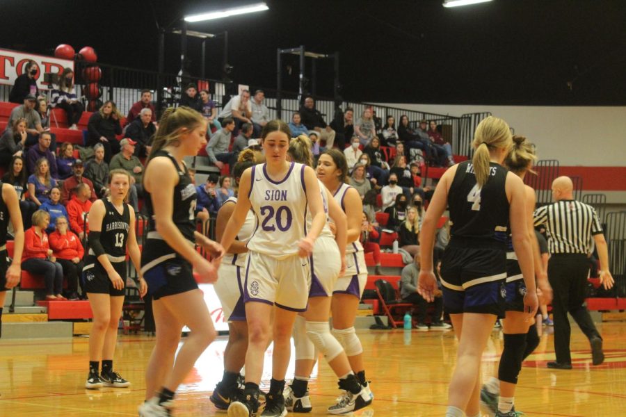 Senior Anna Sheedy walks on the court. 