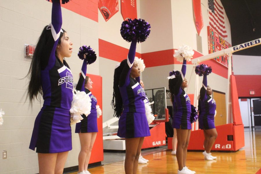 Our cheer team cheers on our girls. 