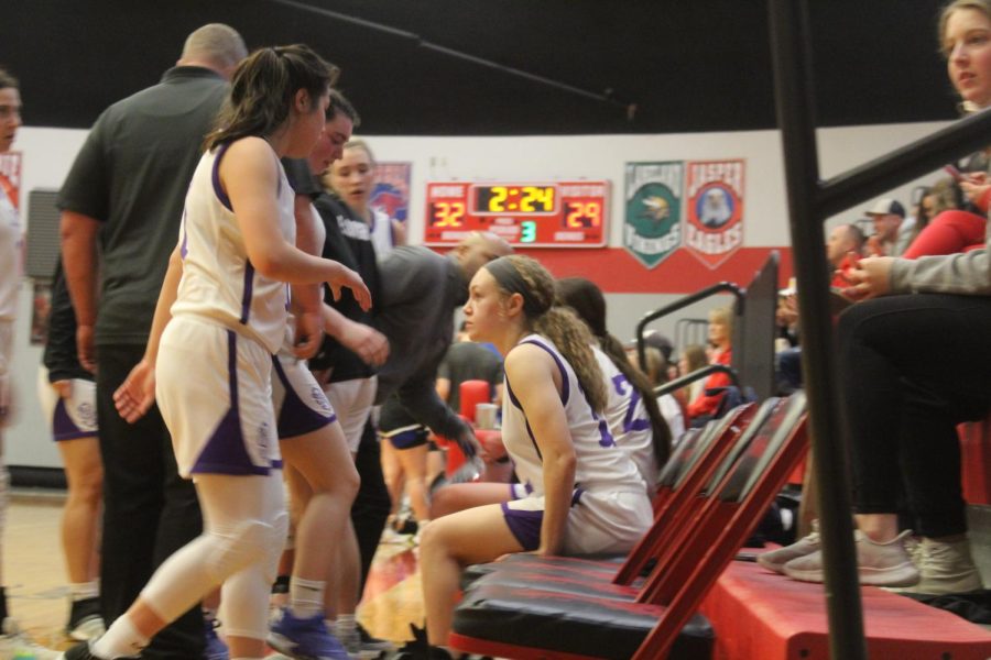 The team takes a break during a time-out. 