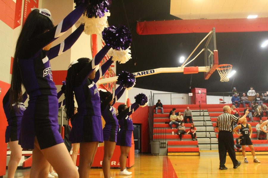 Sion cheer team supports the basketball team. 