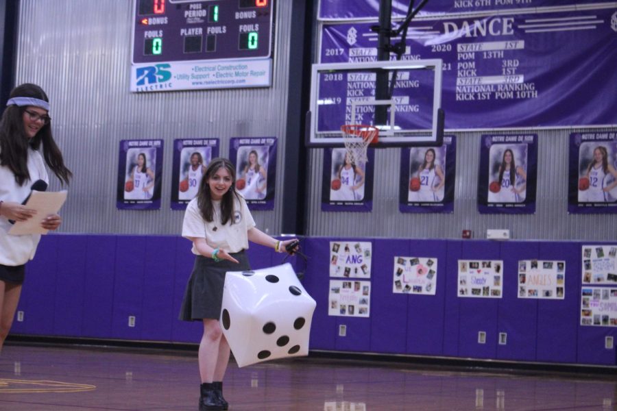 Senior Olivia Mancina rolls the dice to see how many points she'll earn for the senior class. 