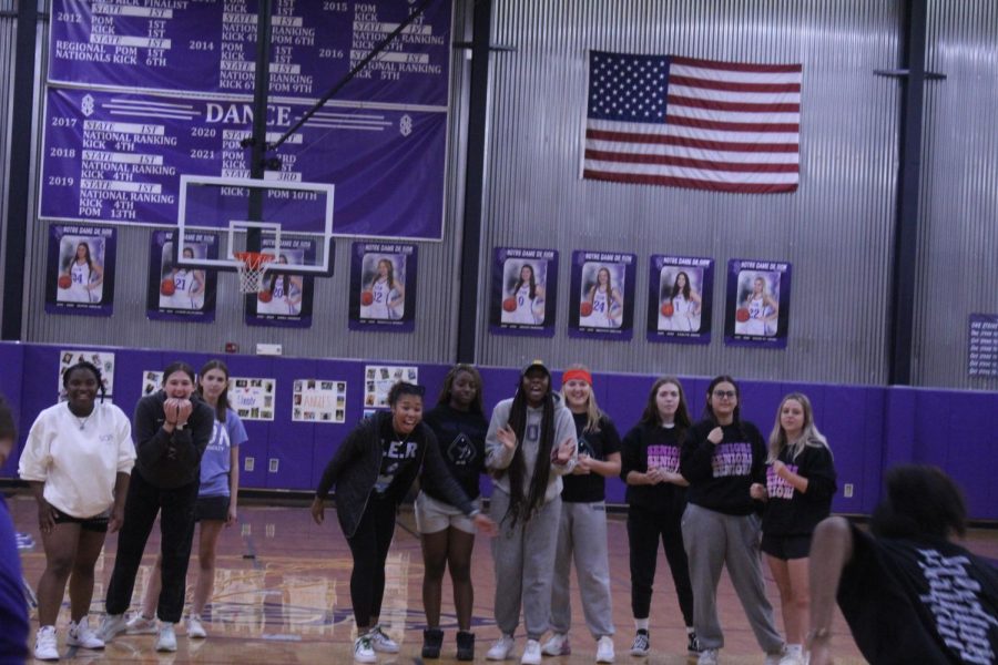 The juniors cheer on their classmate.