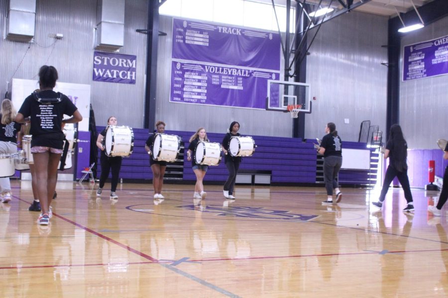 Members of Drum Line walk up like they own the place. 