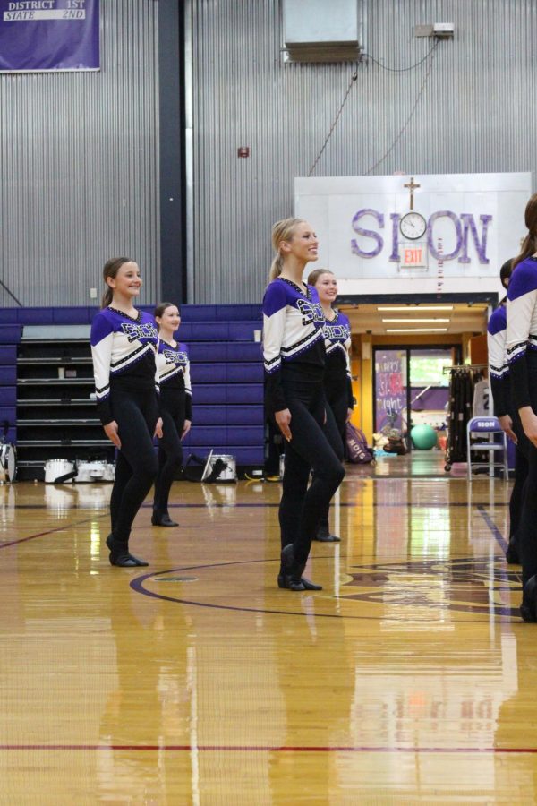 Junior Ava Townsend prepares to start the dance team's kick routine 